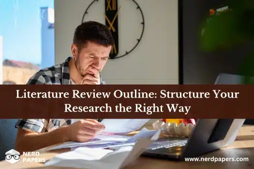 Student organizing research and sources while creating a literature review outline
